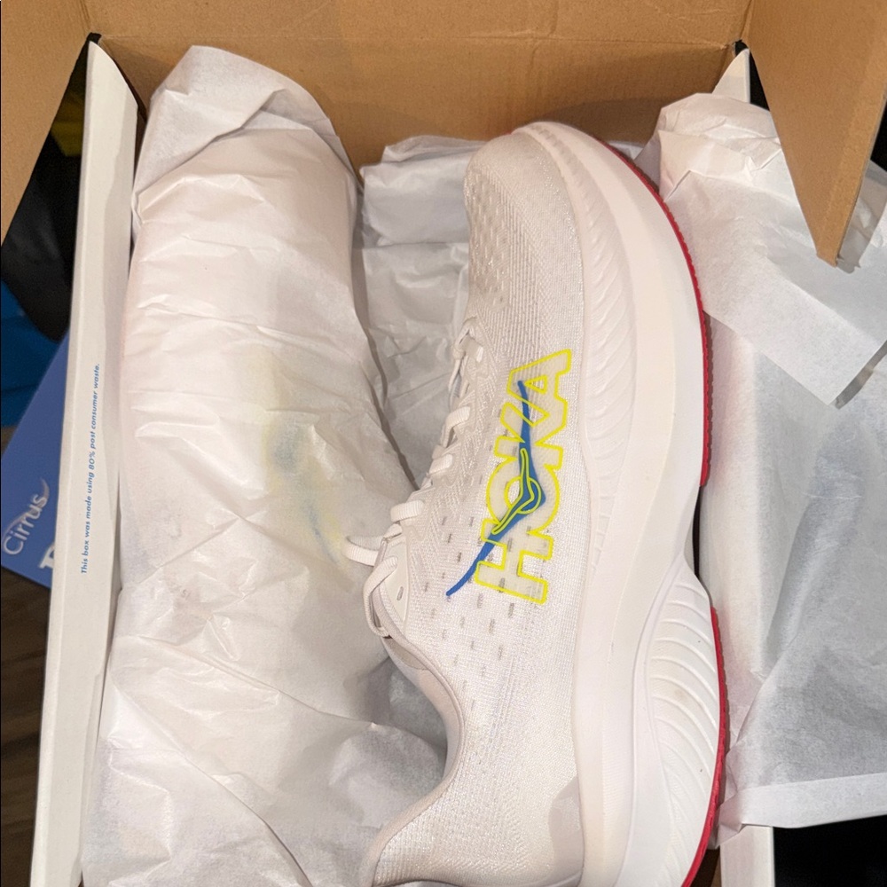 Hoka Women's White Running Shoe with Yellow and Blue Logo